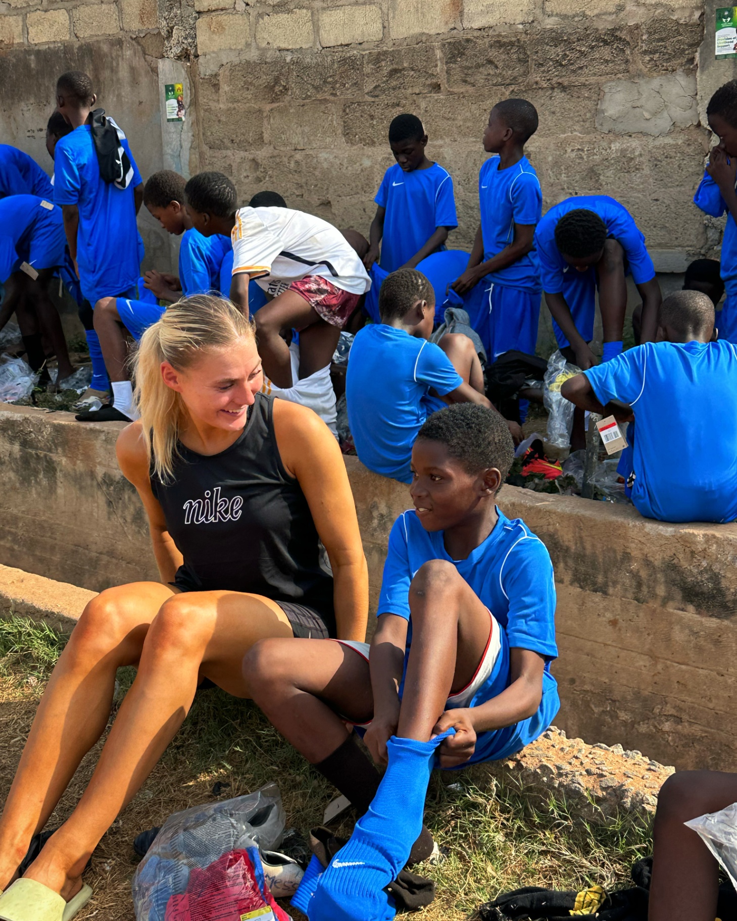 Laura Juul Hansen with young players in Africa